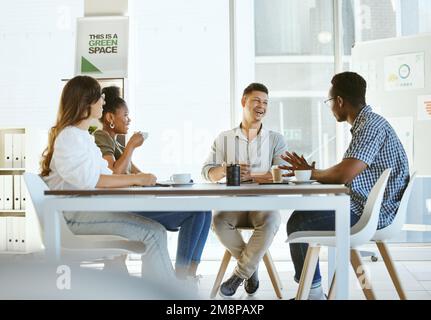 Group of diverse businesspeople having a meeting in an office at work. Cheerful businesspeople talking and laughing during a workshop. Businesspeople Stock Photo