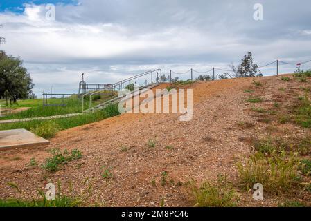 Part of the levee bank and a floodgate that protects the town of Nyngan from flooding from the Bogan River in northwest New South Wales, Australia Stock Photo