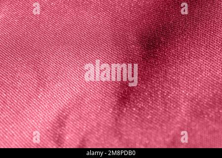 Viva Magenta Colored Texture. Color of the year 2023. Macro. Abstract Pattern of Textile. Close Up. Denim. Background with Textured Material and Polye Stock Photo