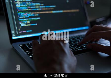 Developer coding in laptop. Programming software concept Stock Photo