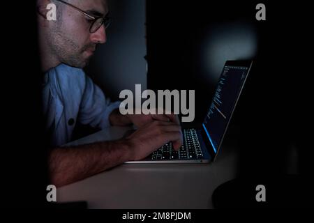 Developer coding in laptop. Programming software concept Stock Photo