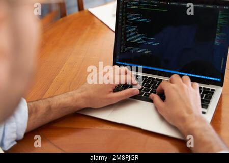 Male coding on laptop. Web developing and software coding concept Stock Photo