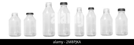 a set of transparent glass bottles of different sizes with a cap, without a cap. Small and large bottles. Empty glass bottles. Stock Photo