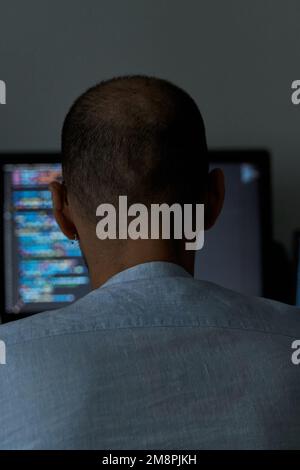 Vertical shot of male writing code. Web developing and software coding concept Stock Photo