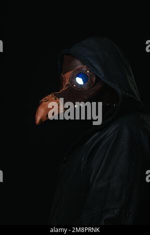 Portrait of plague doctor with crow-like mask isolated on black ...