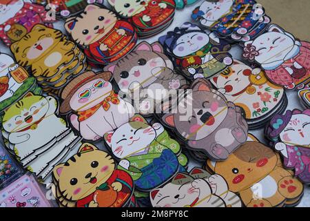 Hanoi, Vietnam. 14th Jan, 2023. Products with cat element are seen at a market at Hang Ma street in Hanoi, capital of Vietnam, Jan. 14, 2023. As the Lunar New Year approaches, products featuring the image of cat are popping up in the market of Hang Ma street in Hanoi. Cat is the zodiac animal of the upcoming Lunar New Year in Vietnam. Credit: Hu Jiali/Xinhua/Alamy Live News Stock Photo