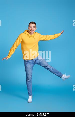 young happy man in casual clothes jumping Stock Photo