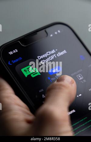 Woman's hand holding an iPhone with appstore and ChatGPT and Chat bot apps, artificial intelligence time. 01.01.2023 Amsterdam, Netherlands Stock Photo