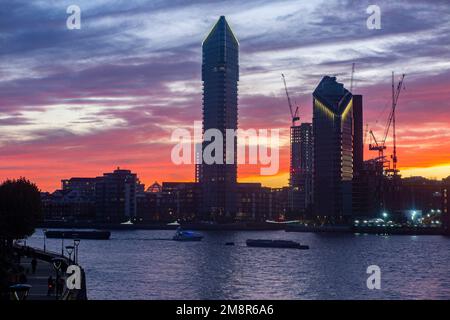 The Chelsea Waterfront skyline on the River Thames at sunset with Tower West, Chelsea Harbour and Lots Road Power Station Stock Photo