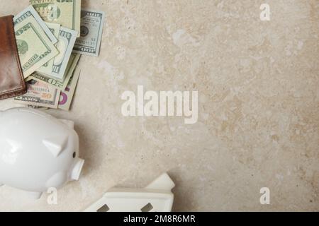 Home budget planning. Cost of living. Inflation concept. Concept of saving money for buying new house. Piggy bank, wallet with dollar banknotes and mo Stock Photo