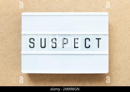Lightbox with word suspect on wood background Stock Photo