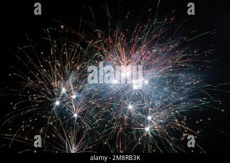 A fireworks display against the night sky Stock Photo