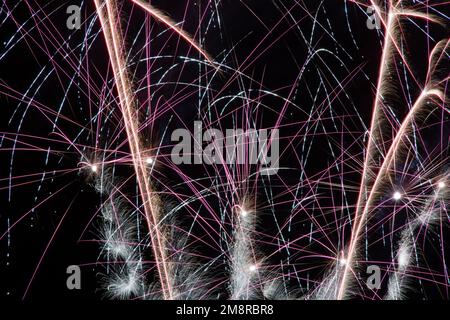 A fireworks display against the night sky Stock Photo