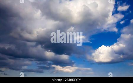 Beautiful dark stormy clouds on a blue sky before a thunderstorm Stock Photo