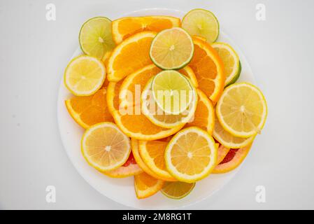 bowl of healthy fresh fruit salad on a white background. Top view with copy space. Lying flat Stock Photo