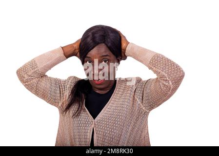portrait of a beautiful mature woman holding hands on her head while smiling at the camera. Stock Photo