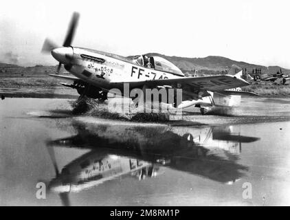 F-51 Mustang taxis through a puddle in Korea, September 1951 Stock Photo