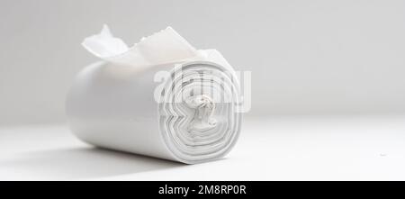 White plastic polyethylene trash bag roll isolated over the white background, set of multiple different foreshortenings. Stock Photo
