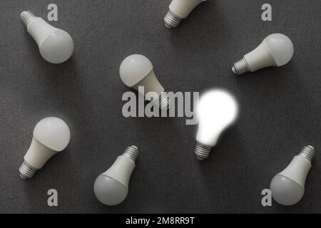 LED light bulbs on gray color background. Flat lay. Pattern. Stock Photo