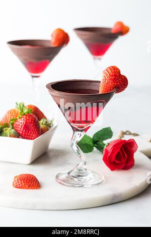 Bright red Valentine's Day cocktails with chocolate dipped rims. Stock Photo