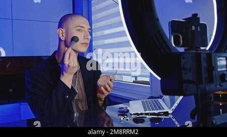 Male beauty blogger making a video tutorial on makeup. High quality photo Stock Photo