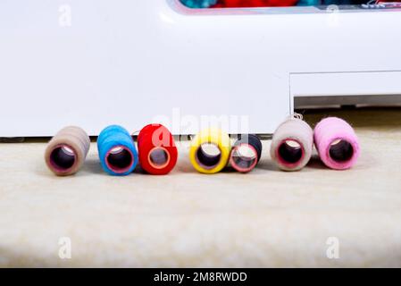 set of colored sewing threads for sewing on a machine. Stock Photo