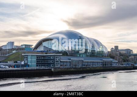 Exterior view of the Norman Foster designed music venue The Sage Gateshead, now known as The Glasshouse, seen over the River Tyne. Stock Photo