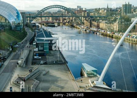 A view across the River Tyne including the Tyne Bridge, the Sage Gateshead music venue, now known as The Glasshouse, and Newcastle upon Tyne, UK. Stock Photo
