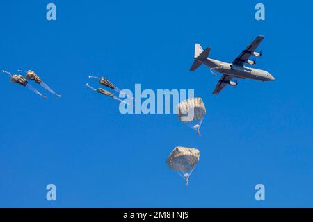 JGSDF Narashino Training Field, Chiba, Japan. 8th Jan, 2023. U.S. Army paratroopers from the 11th Airborne Division, jump out of a U.S. Air Force C-130J Super Hercules assigned to the 36th Airlift Squadron during the annual New Year's jump at Camp Narashino, Chiba, Japan, on January. 8, 2023. Approximately 200 paratroopers jumped out of several aircraft in a multilateral collaboration of U.S. Air Force, U.S. Army, British army, Australian army, and Japan Ground Self-Defense Force members. Credit: U.S. Air Force/ZUMA Press Wire Service/ZUMAPRESS.com/Alamy Live News Stock Photo