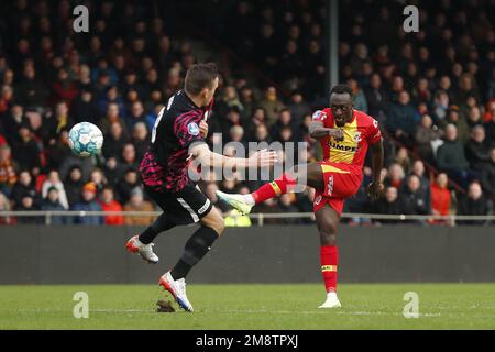 DEVENTER - (lr) Jens Toornstra of FC Utrecht, Bobby Adekanye of Go Ahead Eagles scores the 1-1 during the Dutch premier league match between Go Ahead Eagles and FC Utrecht at De Adelaarshorst on January 15, 2023 in Deventer, Netherlands. ANP BART STOUTJESDYK Stock Photo