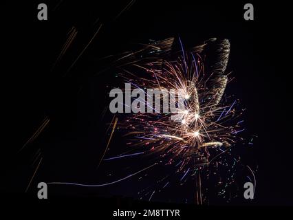 Fireworks exploding in the night sky Stock Photo