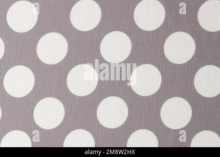 Gray and white fabric with polka dot pattern. Stock Photo