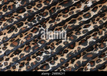 Stipes of fabric with leopard pattern close up. Stock Photo