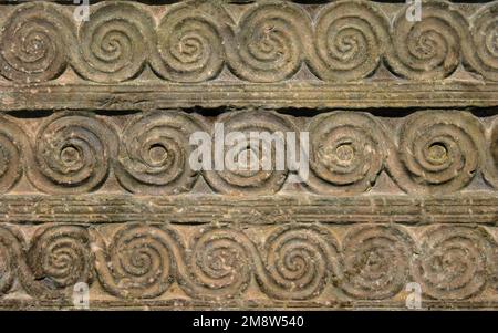 Byzantine ornament, pattern carved in old stone wall, ancient texture background, vintage geometric relief. Decoration of Roman Greek architecture. Th Stock Photo
