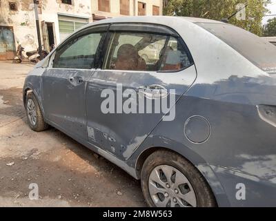 A closeup of a damaged car with scratches on the doors Stock Photo