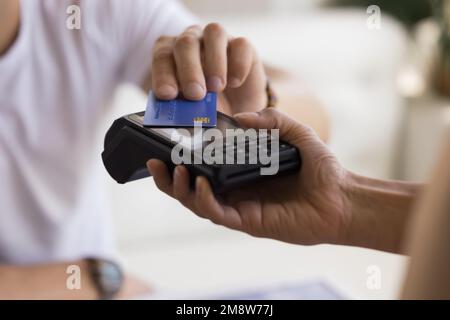 Customer man making payment for service, purchase, cashless technology Stock Photo