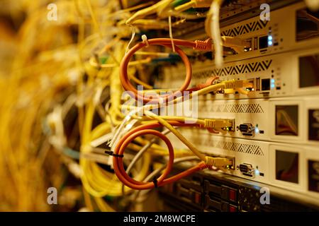 Background macro shot of cables and wires connected to servers, copy space Stock Photo