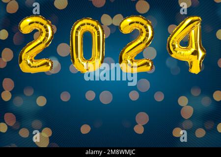 New Year 2024 celebration. Golden Yellow foil color balloons. 2024 balloons. On Blue background Stock Photo