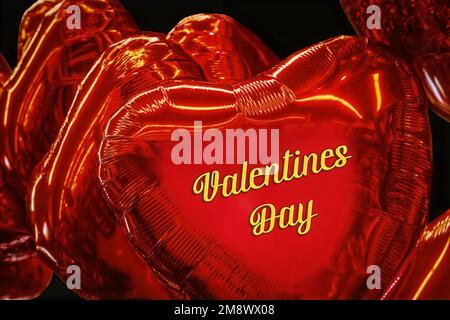 Bright red heart shaped mylar balloons Background says Valentines Day - Closeup on black background Stock Photo