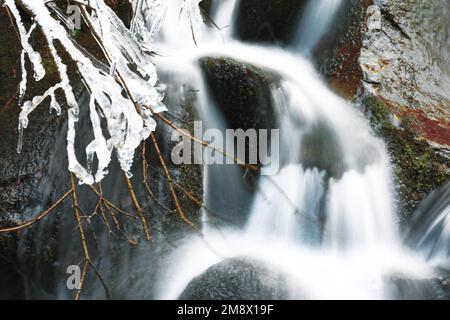 Long exposure frozen waterfall . Frost water cascade Stock Photo