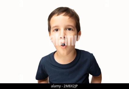 Portrait of a shocked young man against a gray background Stock Photo