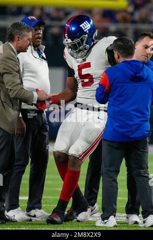 January 1, 2023, East Rutherford, New Jersey, USA: New York Giants  defensive ends Leonard Williams (99) and Kayvon Thibodeaux (5) tackle  Indianapolis Colts running back Zack Moss (21) during a NFL game