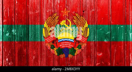 Flag of Pridnestrovian Moldavian Republic on a textured background. Concept collage. Stock Photo