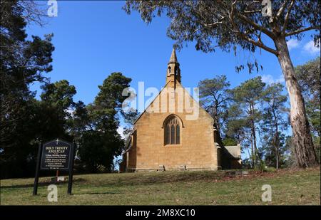 Berrima, New South Wales, Australia - 30 Aug 2022: The historic sandstone Holy Trinity Anglican Church, situated in a grove of eucalyptus trees. Stock Photo