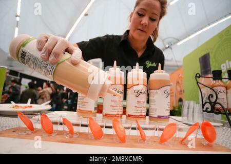 Vancouver, Canada. 15th Jan, 2023. A vendor prepares food samples at a booth during the Gluten Free Expo in Vancouver, British Columbia, Canada, on Jan. 15, 2023. Credit: Liang Sen/Xinhua/Alamy Live News Stock Photo