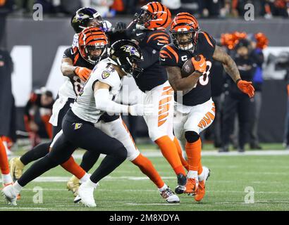 Cincinnati, United States. 15th Jan, 2023. Cincinnati Bengals halfback Joe  Nixon (28) tries to break free from Baltimore Ravens Kyle Hamilton (14)  during the first half of play in the AFC Wild Card game at Paycor Stadium  on Sunday, January 15, 2023 in