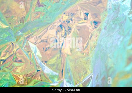 Abstract fashionable rainbow holographic background. Blurred texture of purple, pink and mint colors with irregularities. High quality photo Stock Photo