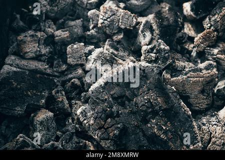 black embers after burnt campfire closeup Stock Photo