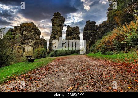 Cultural monument, Externsteine nature reserve, hiking trail in autumn weather, evening sky, Horn-Bad Meinberg, Teutoburg Forest, North Stock Photo