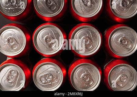 Group of fresh beer cans with drops of water with black background Stock Photo